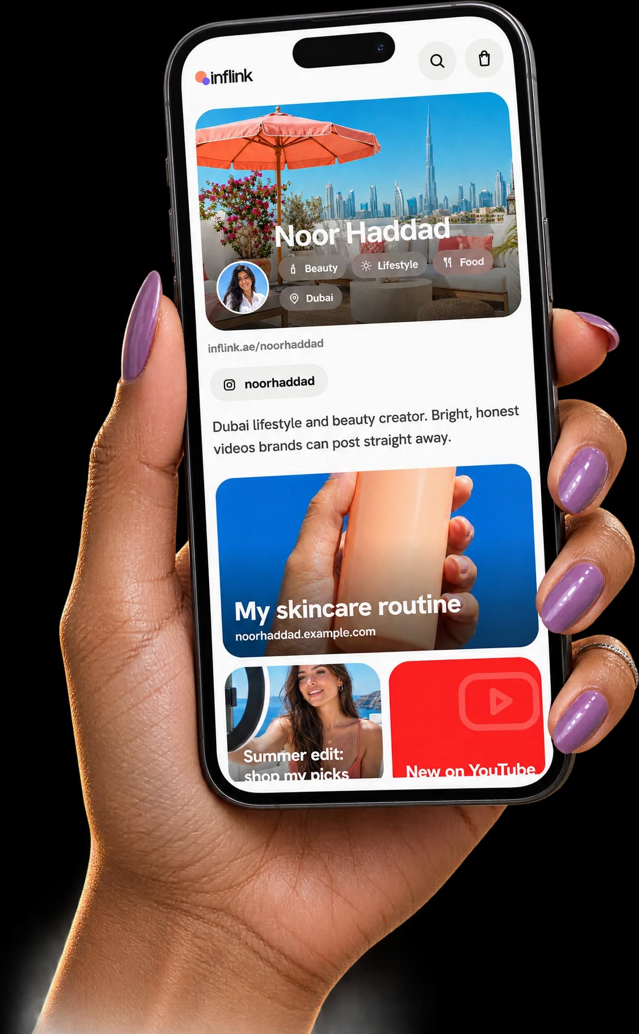 A hand holding a phone showing a creator's Inflink page